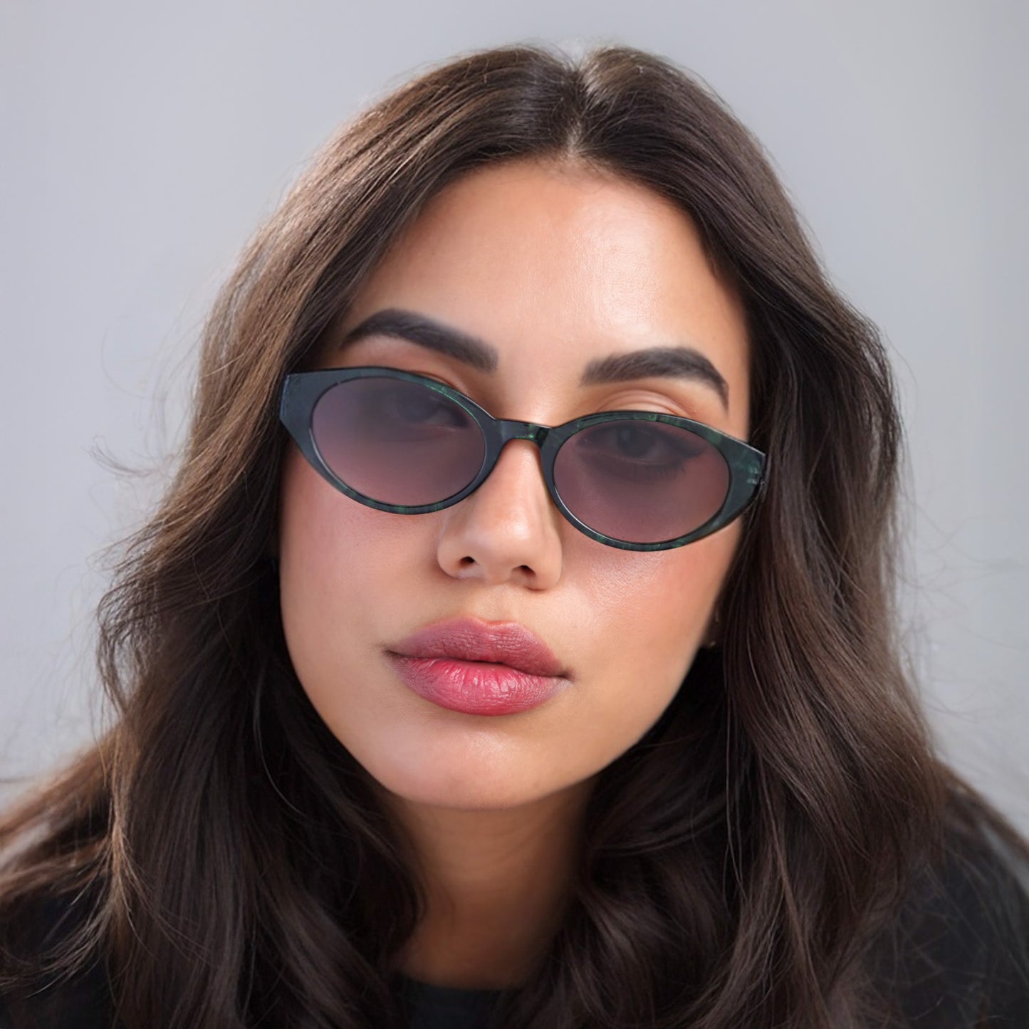 Brunette woman wearing Collins Sunglasses in Emerald with Grey Gradient