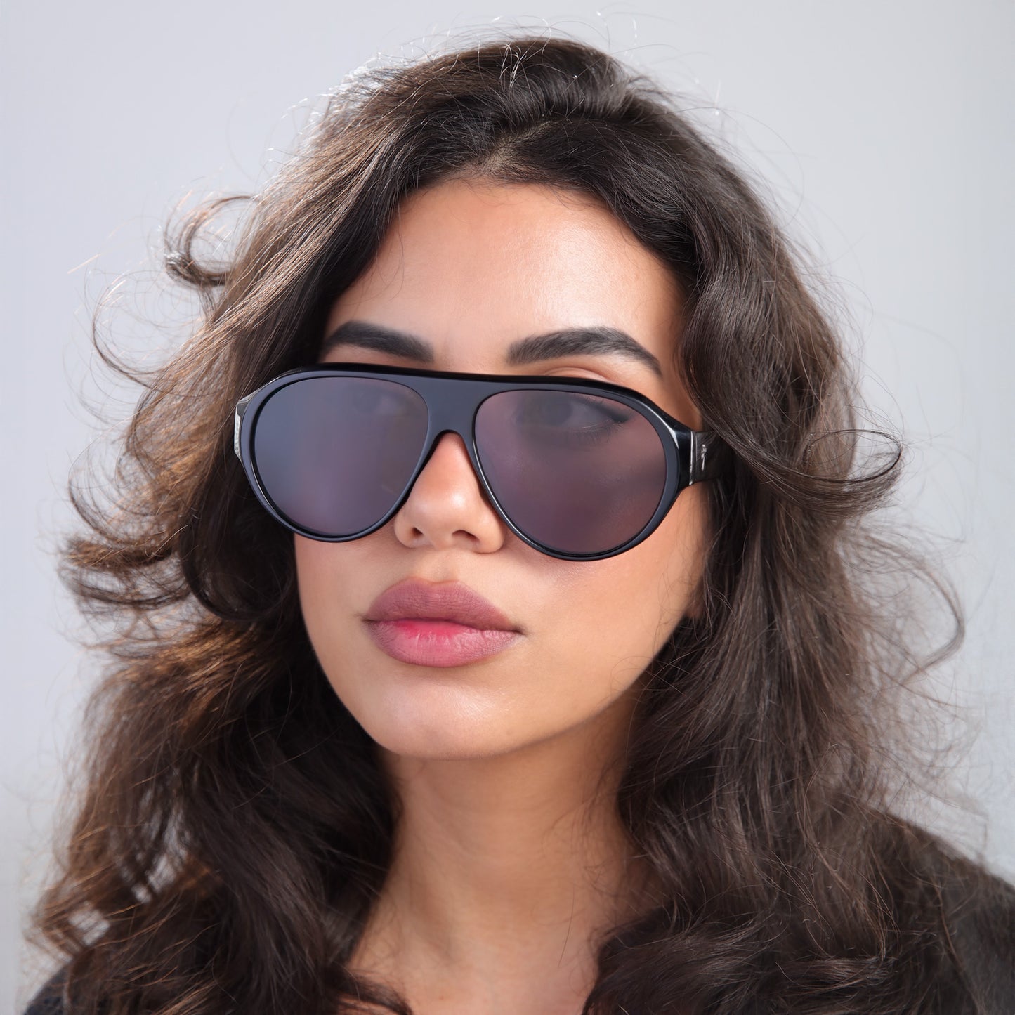 Brunette woman wearing Douglas Sunglasses in Black with Grey lenses