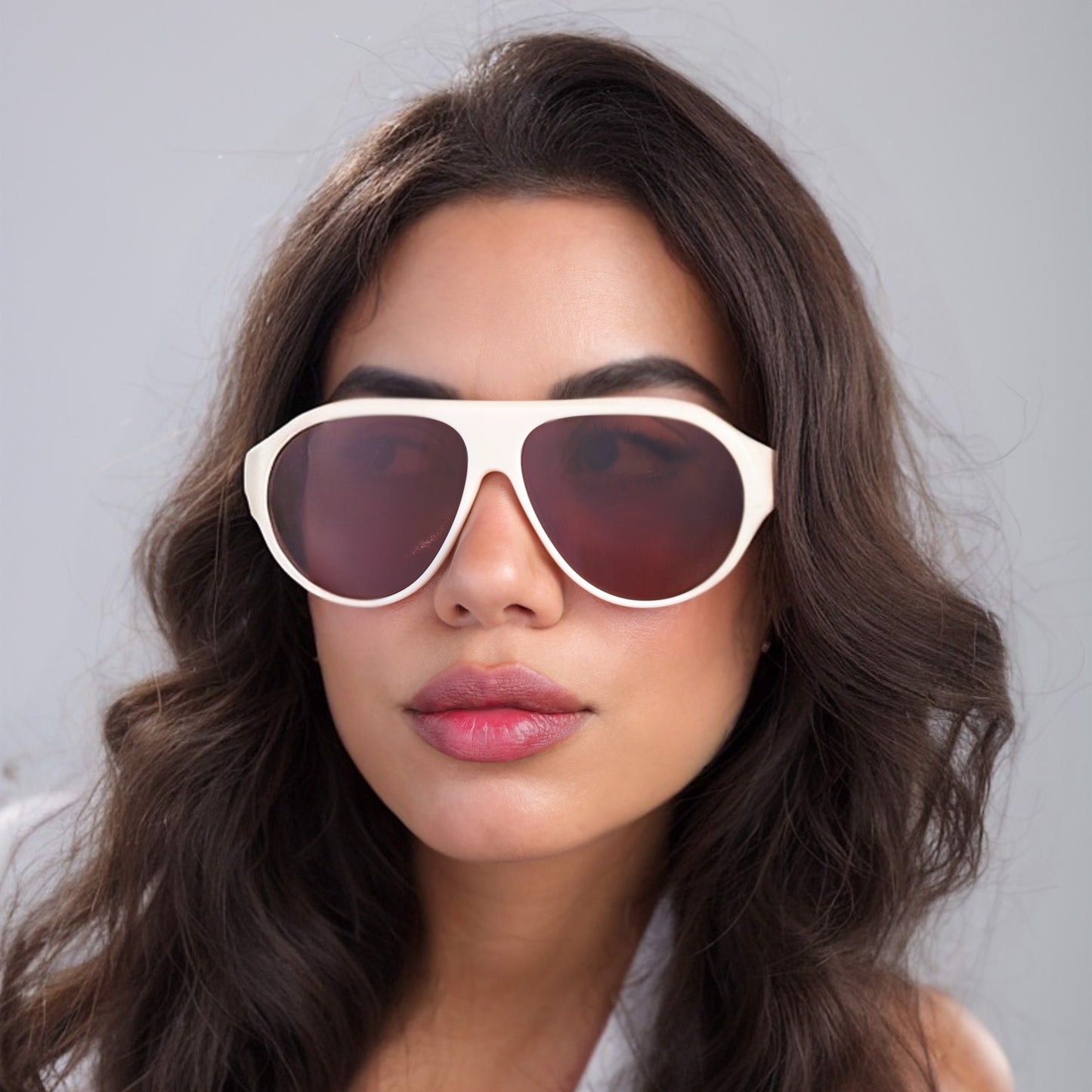 Brunette woman wearing Douglas Sunglasses in Cream with brown lenses