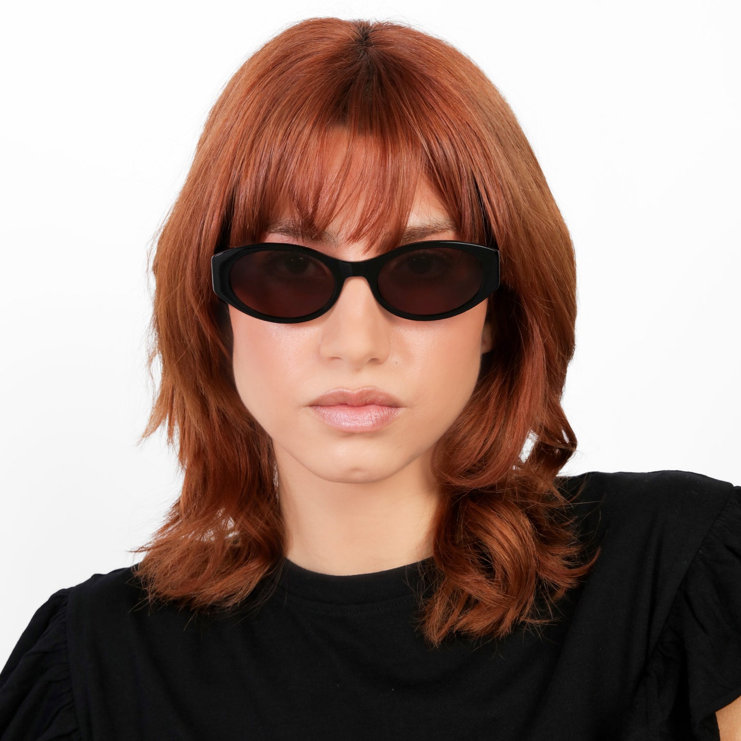 Model wearing Exumas Sunglasses in Black with Brown lenses