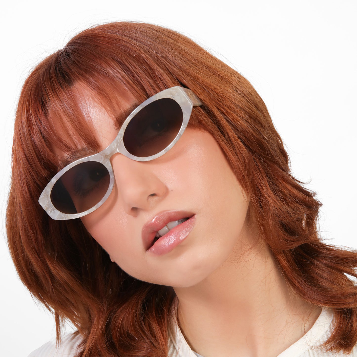 Model wearing Exumas Sunglasses in Pearl with Brown Gradient lenses
