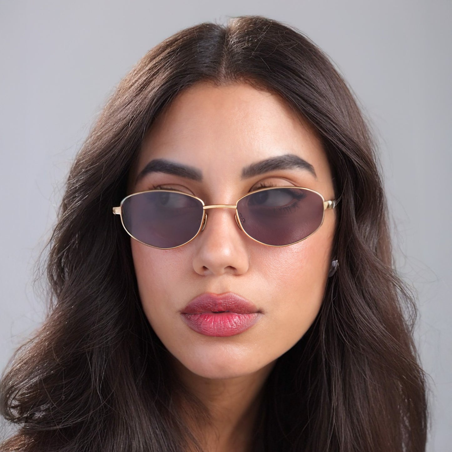 Brunette woman wearing Fisher Sunglasses in Gold Havana with Grey lenses