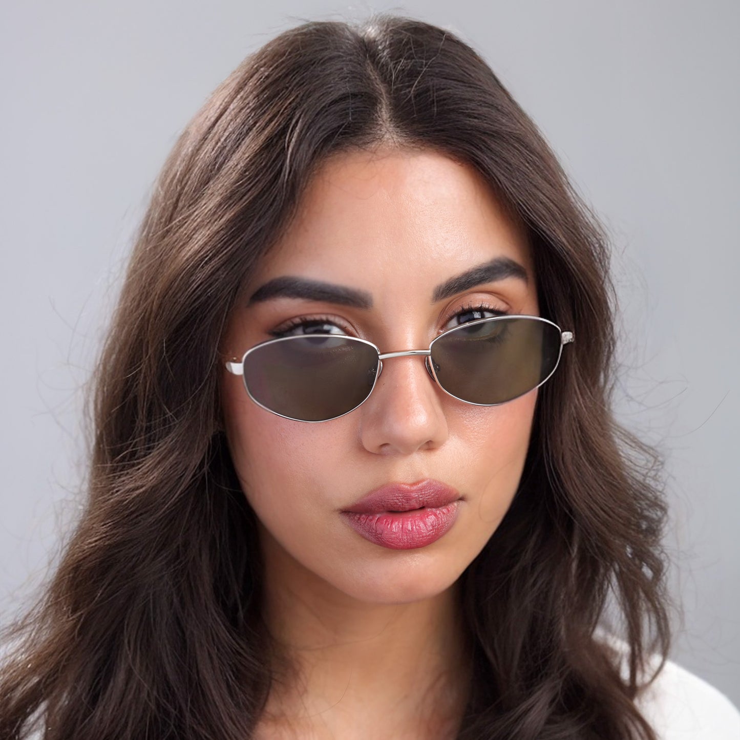 Brunette woman wearing Fisher Sunglasses in Silver Havana with Olive lenses