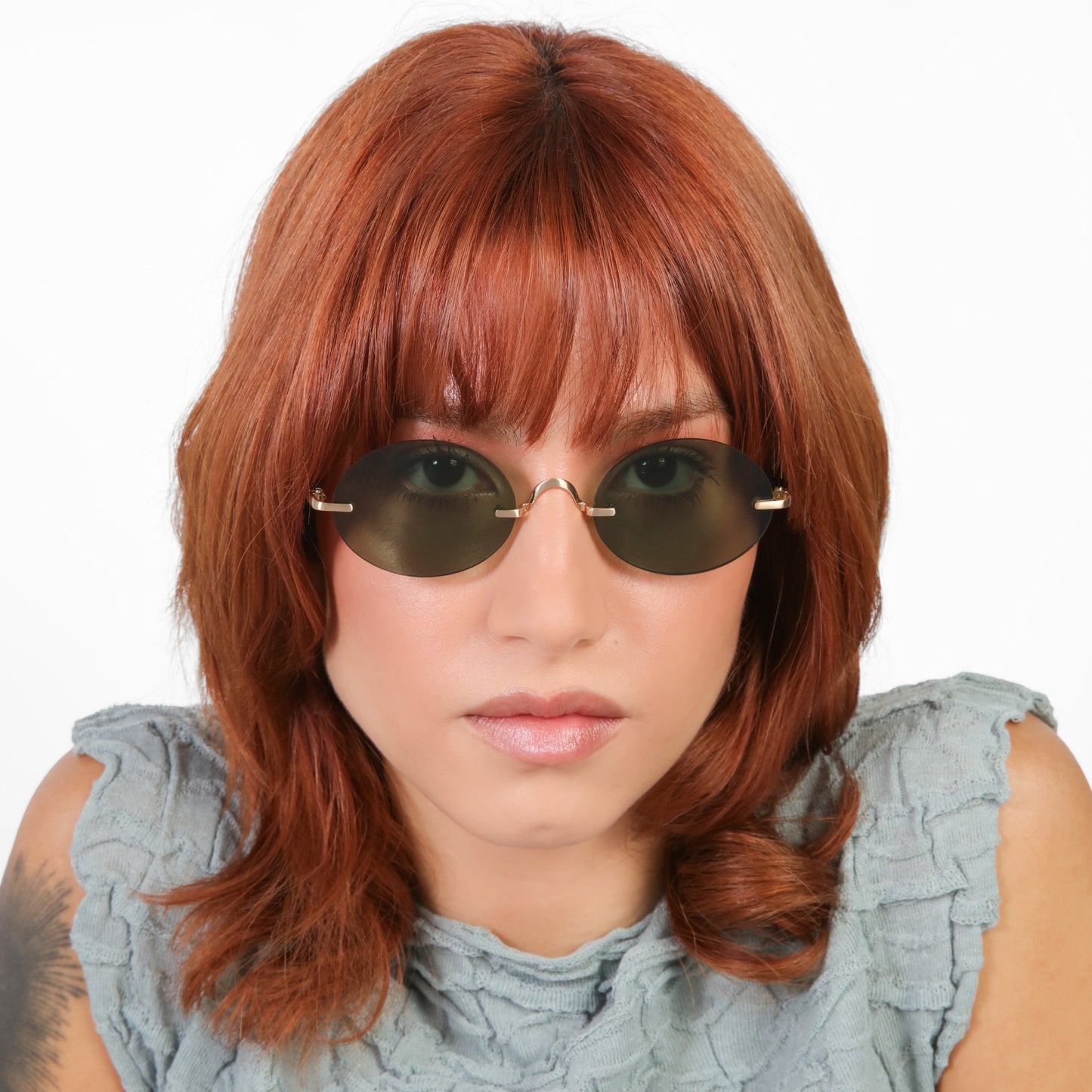Model wearing Havana Sunglasses in Gold with Olive lenses