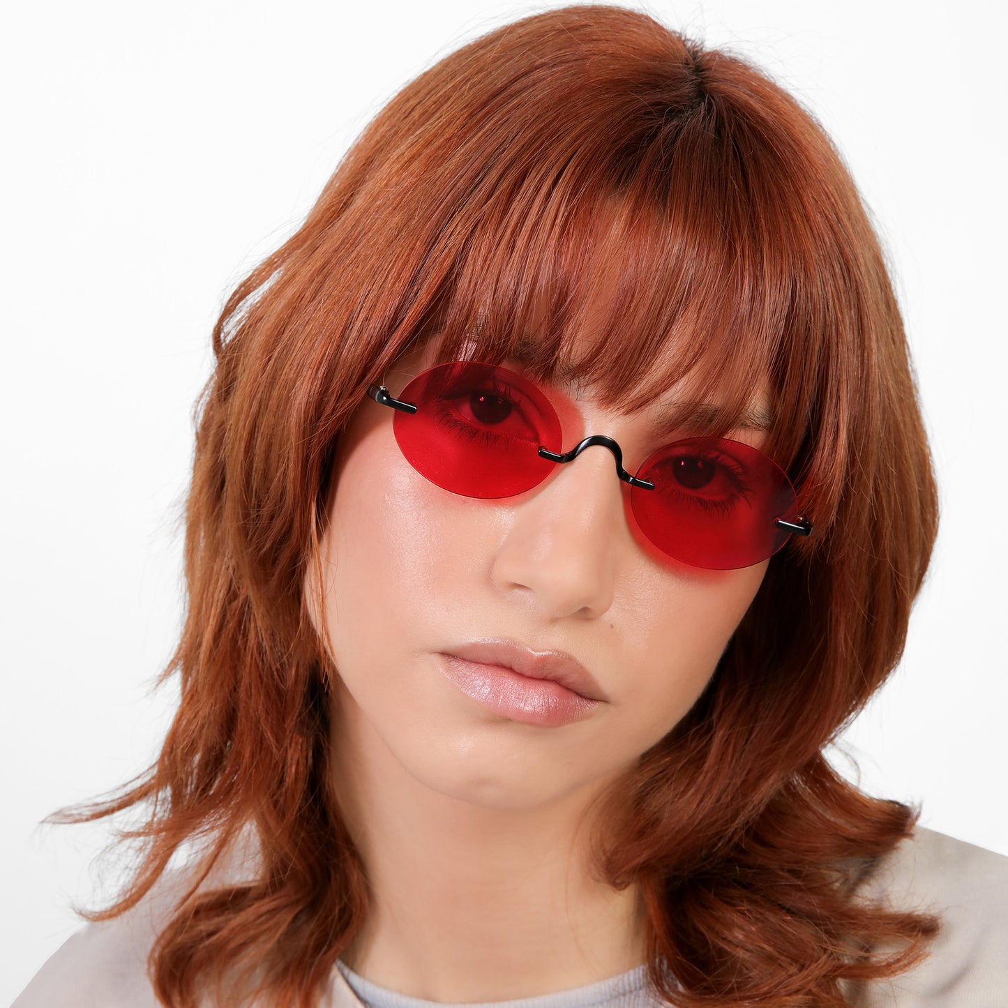 Another angle of model wearing Havana Sunglasses in Matte Black with Red See Through lenses