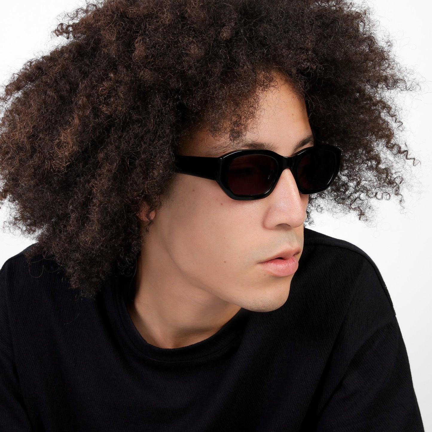 Another angle of man wearing La Gorce Sunglasses in Black with Grey lenses