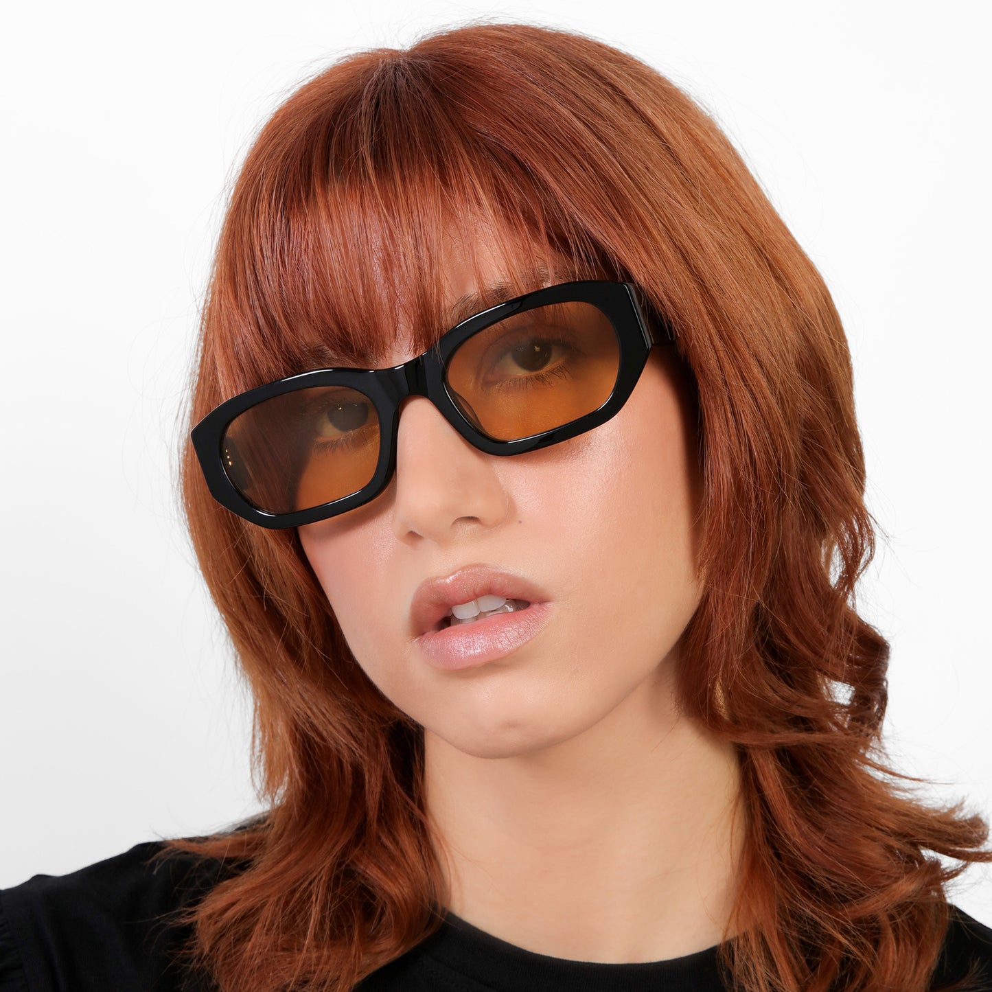 Another angle of model wearing La Gorce Sunglasses in Black with Yellow See Through lenses
