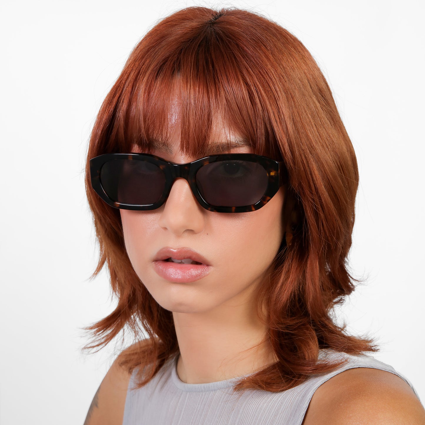 Another angle of model wearing La Gorce Sunglasses in Tortoise with Grey lenses