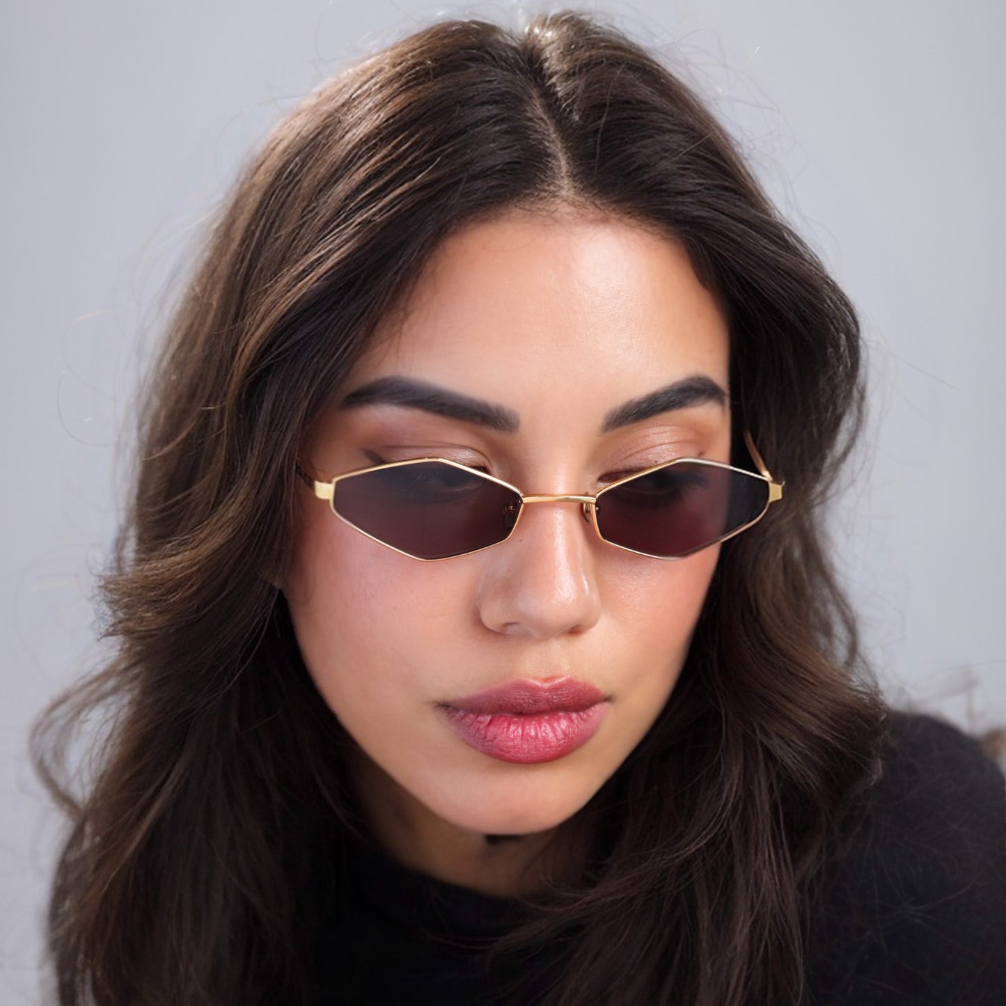 Brunette woman wearing Opa Sunglasses in Gold Havana with Brown lenses