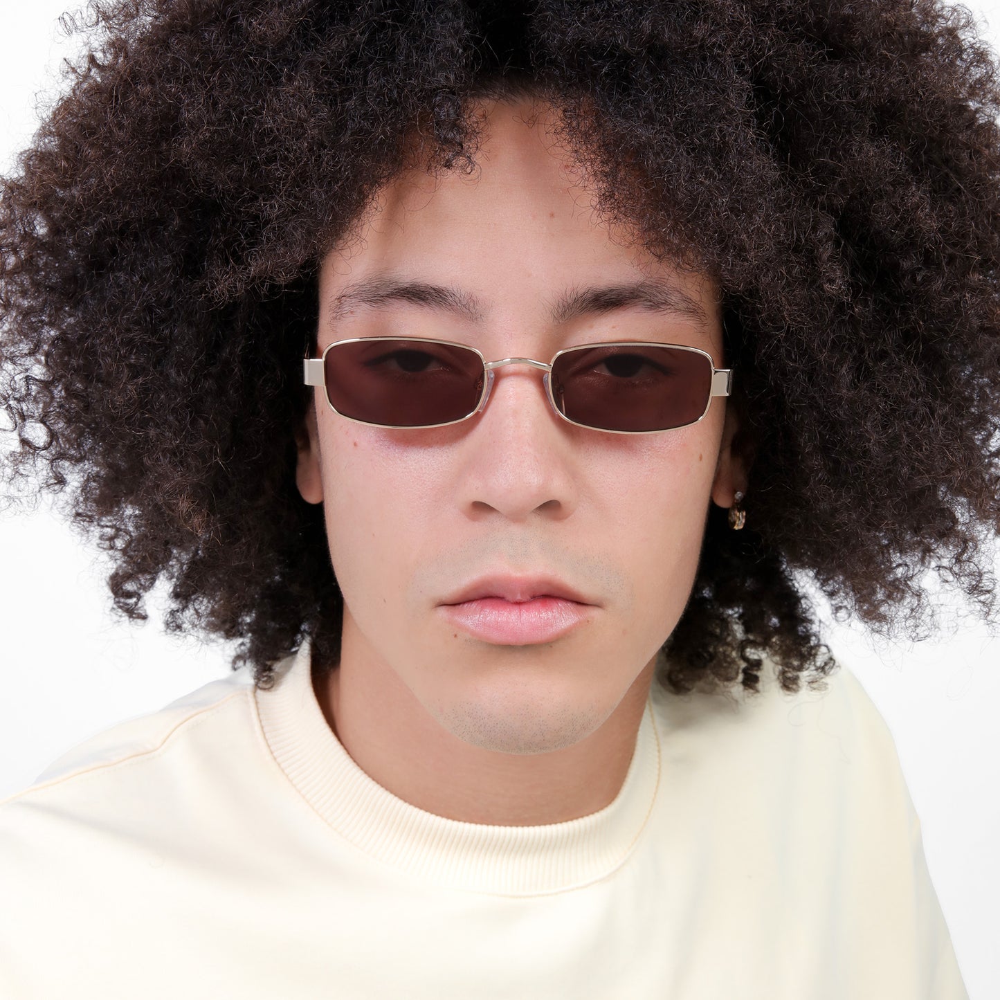Close up of man wearing Shores Sunglasses in Gold with Brown lenses