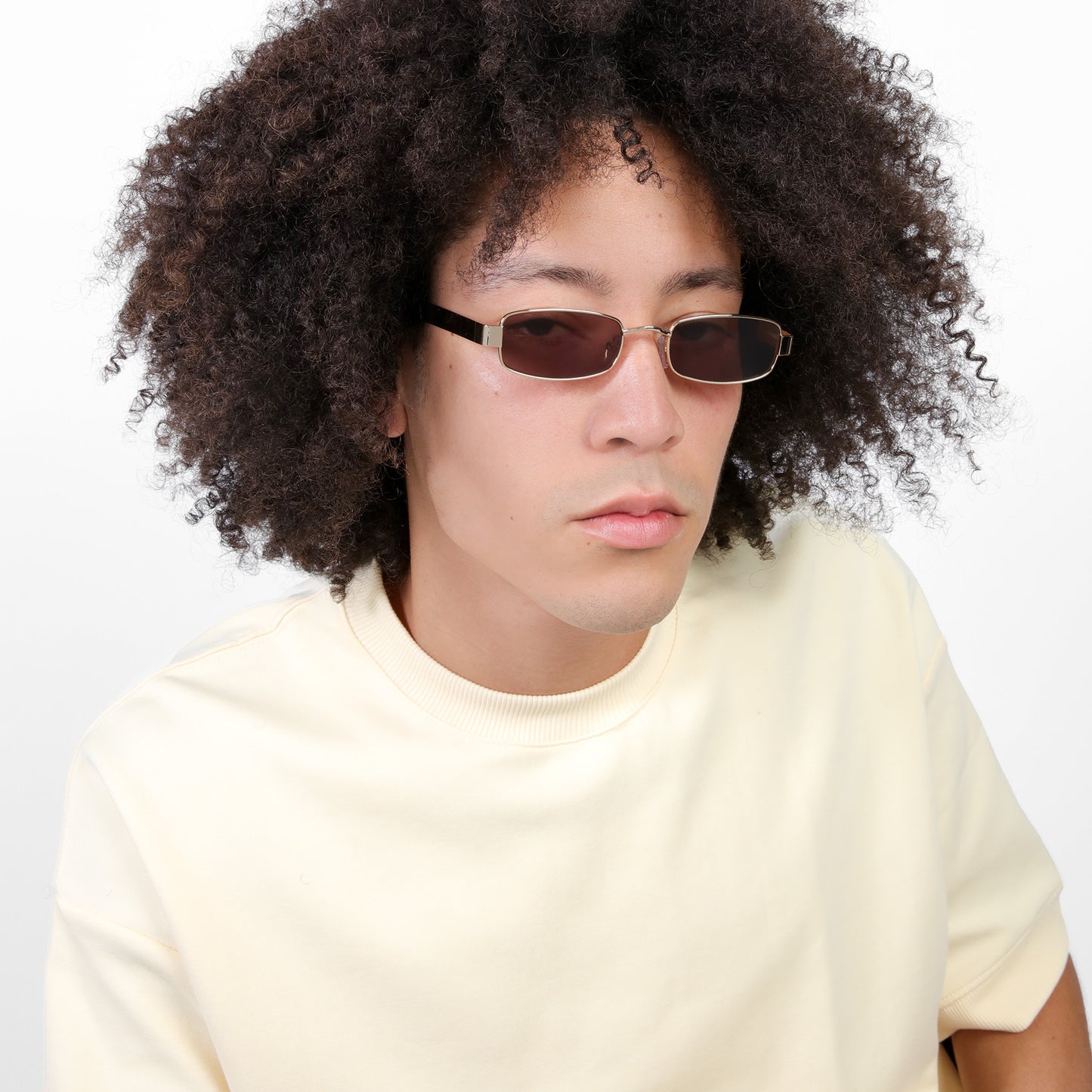 Man wearing Shores Sunglasses in Gold with Brown lenses