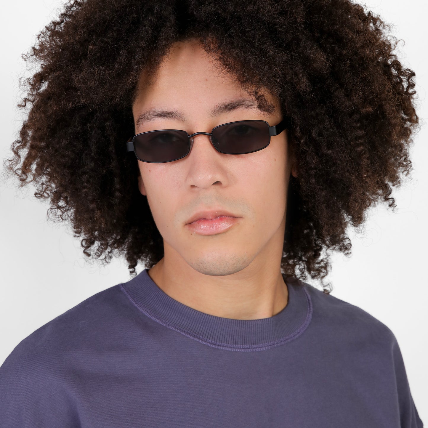 Another angle of man wearing Shores Sunglasses in Matte Black with Grey lenses