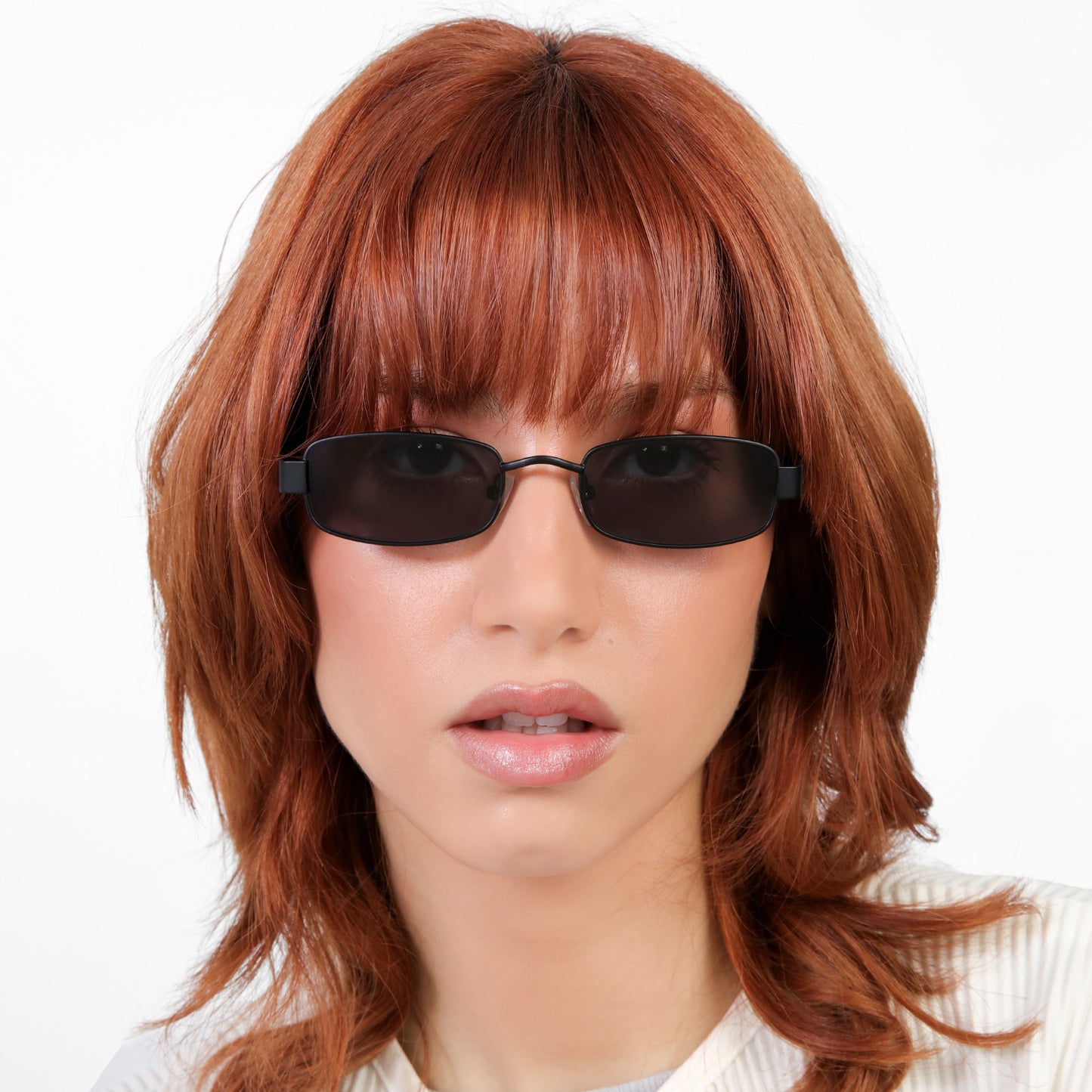 Model wearing Shores Sunglasses in Matte Black with Grey lenses