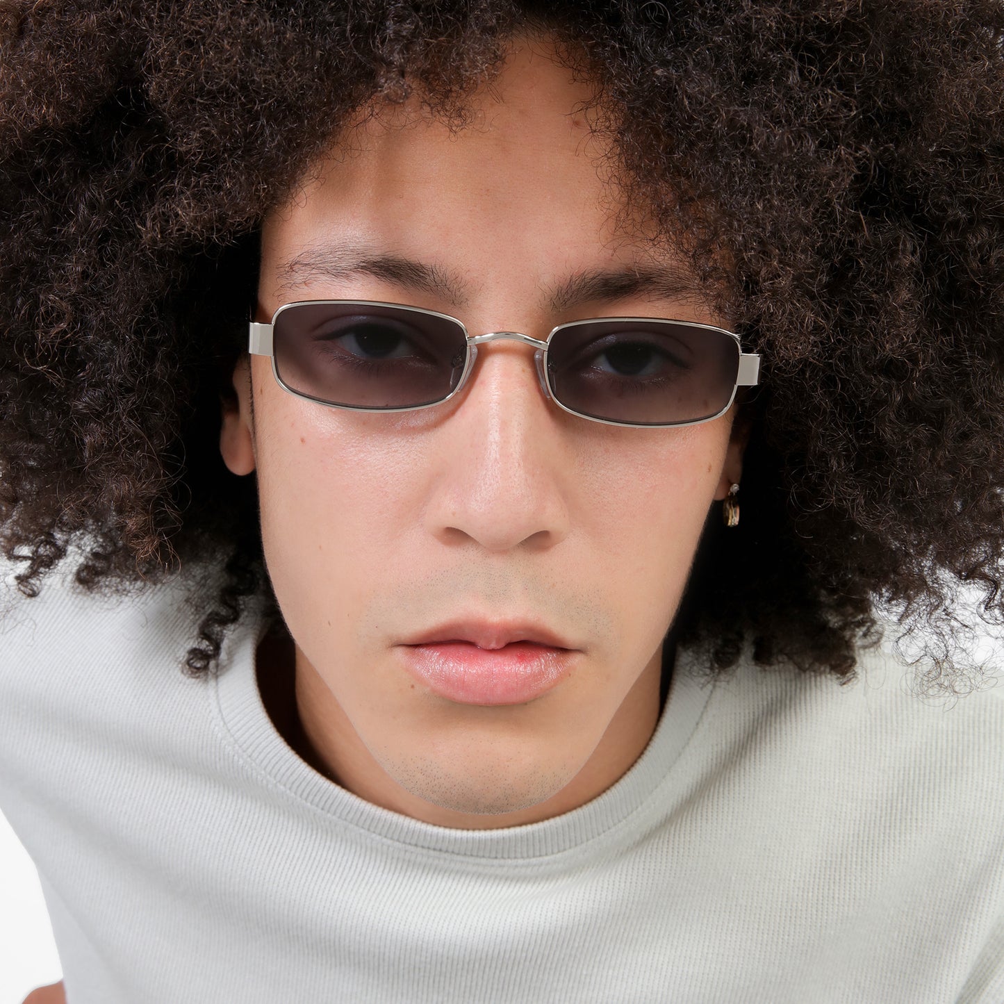 Close up of man wearing Shores Sunglasses in Silver with Grey Gradient lenses