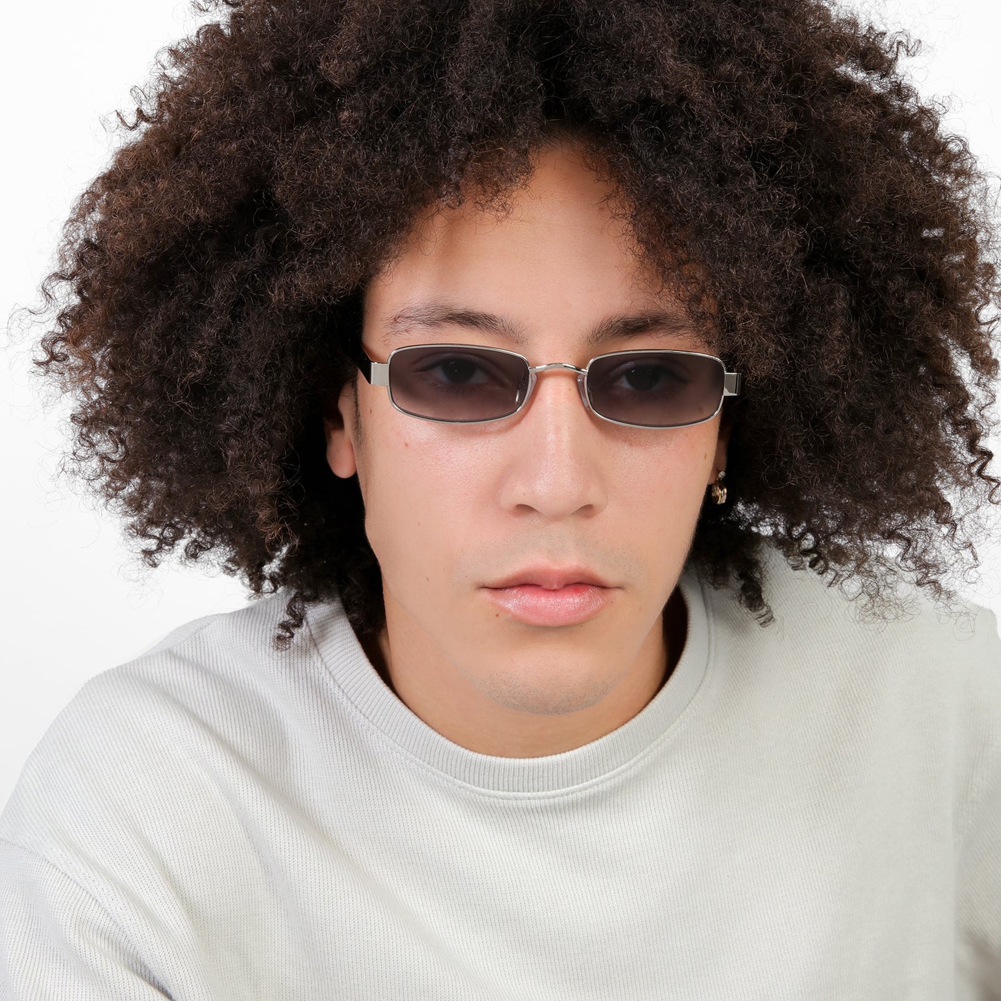 Another angle of man wearing Shores Sunglasses in Silver with Grey Gradient lenses