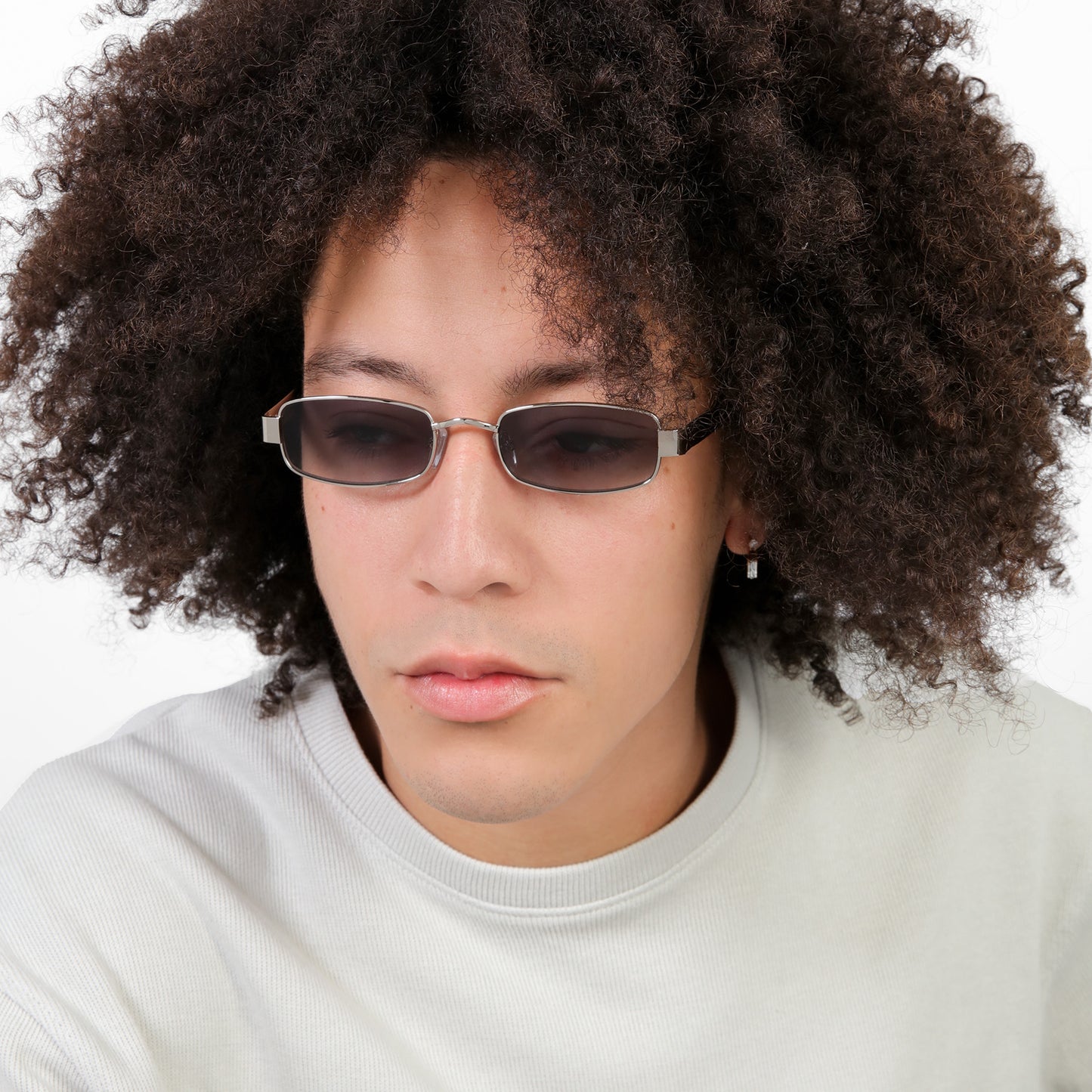 Man wearing Shores Sunglasses in Silver with Grey Gradient lenses