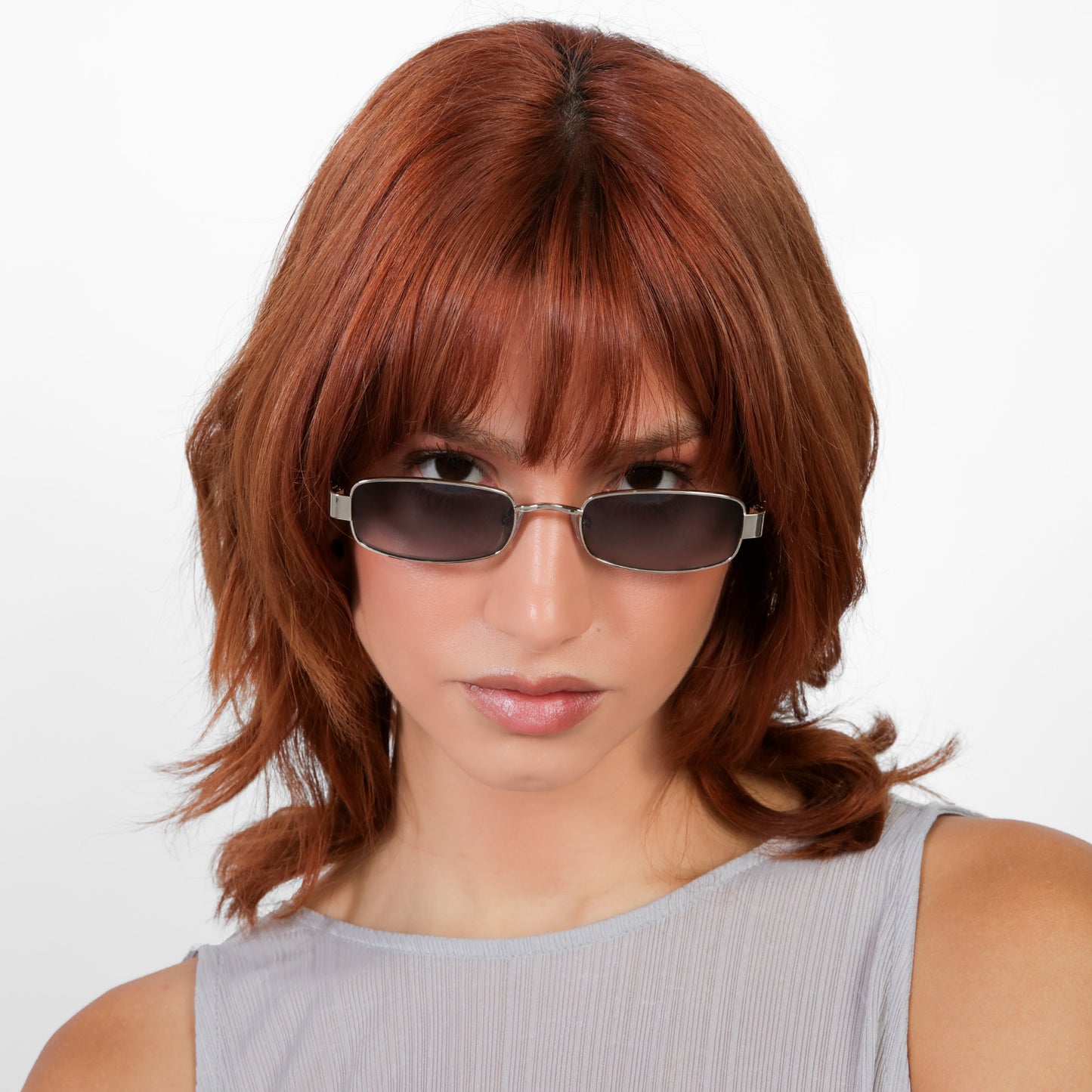 Model wearing Shores Sunglasses in Silver with Grey Gradient lenses