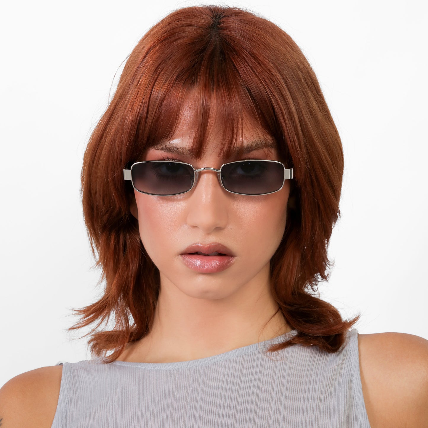 Another angle of model wearing Shores Sunglasses in Silver with Grey Gradient lenses
