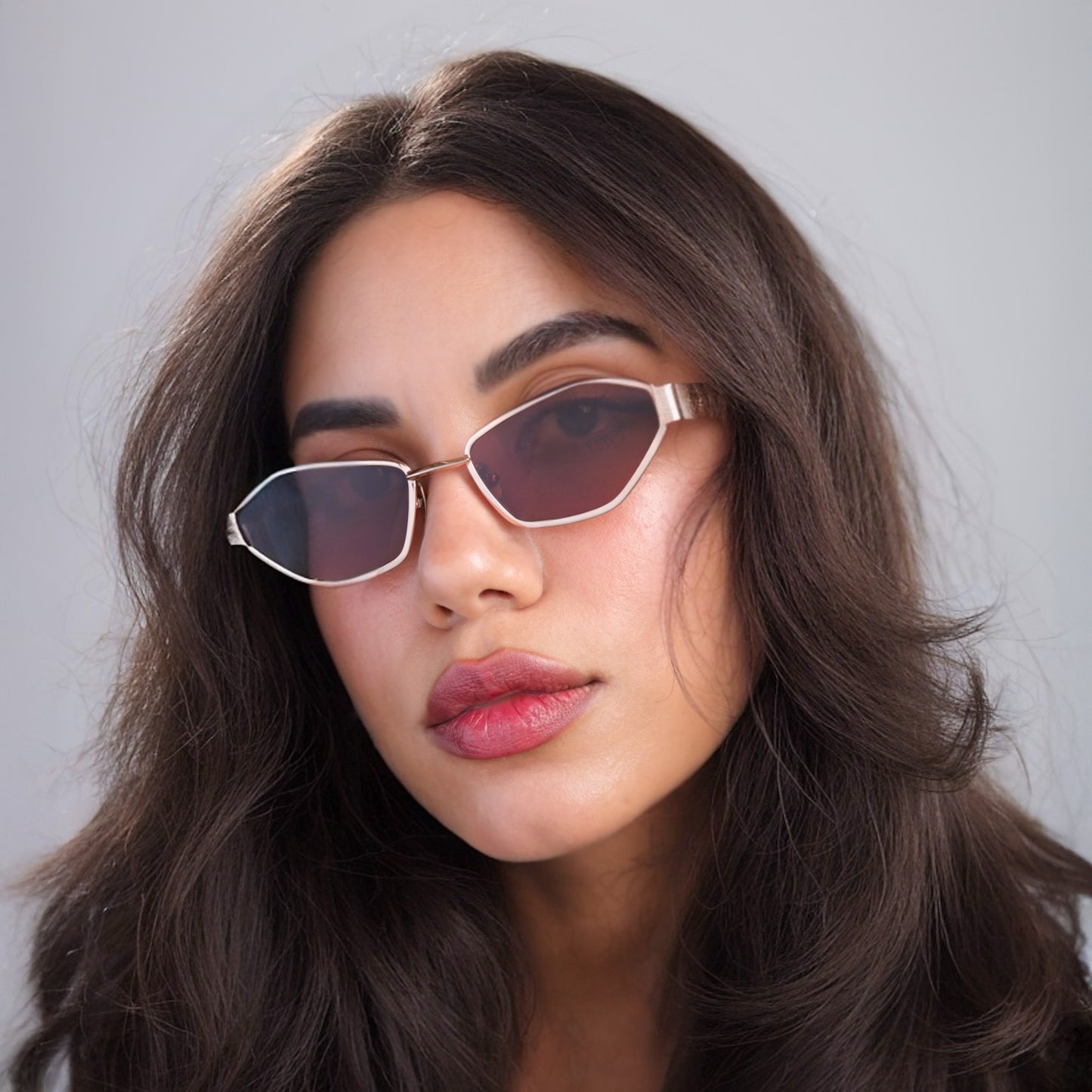 Brunette woman wearing Vista Sunglasses in Rose Gold with Brown lenses