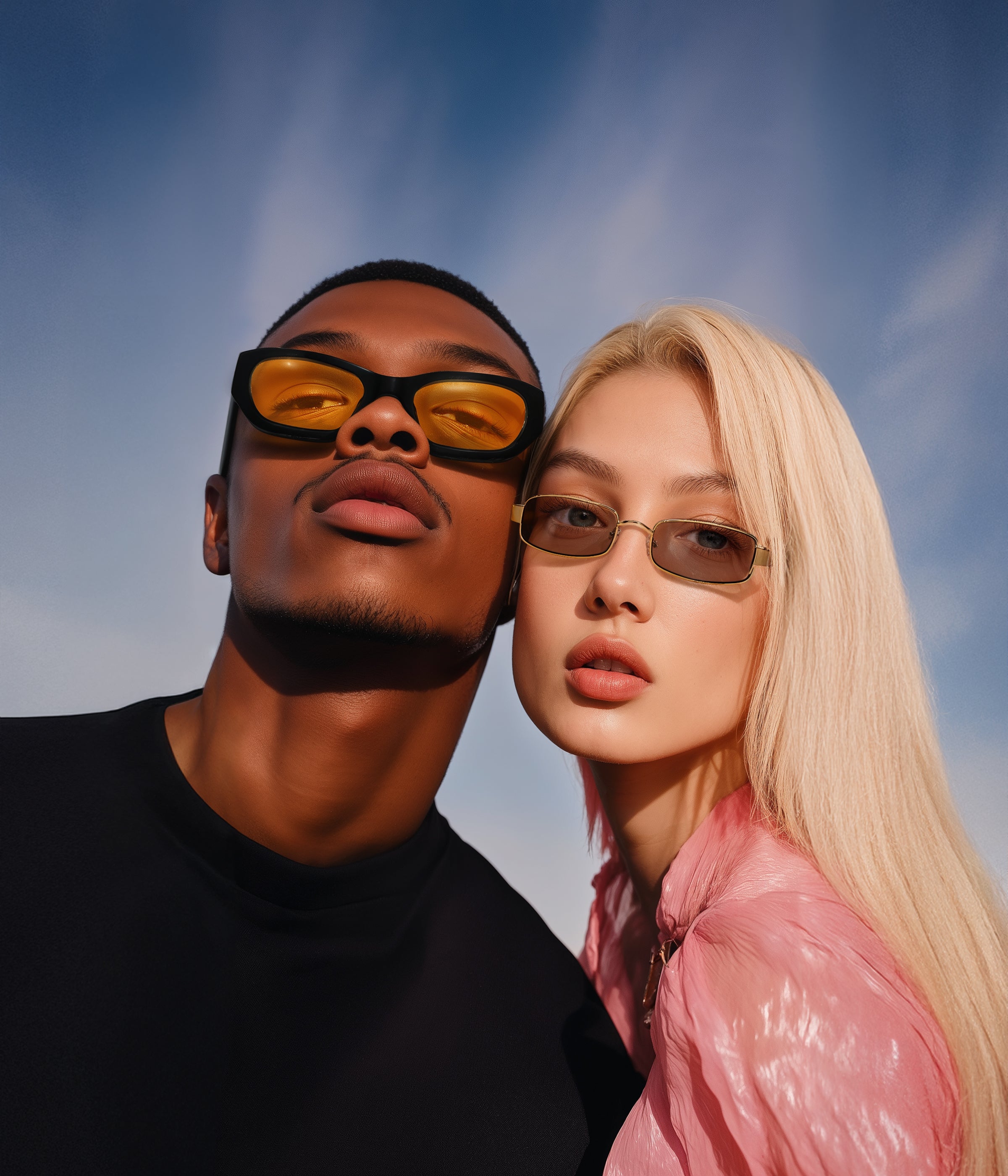 Man and woman at the beach wearing La Gorce Sunglasses and Shores Sunglasses respectively