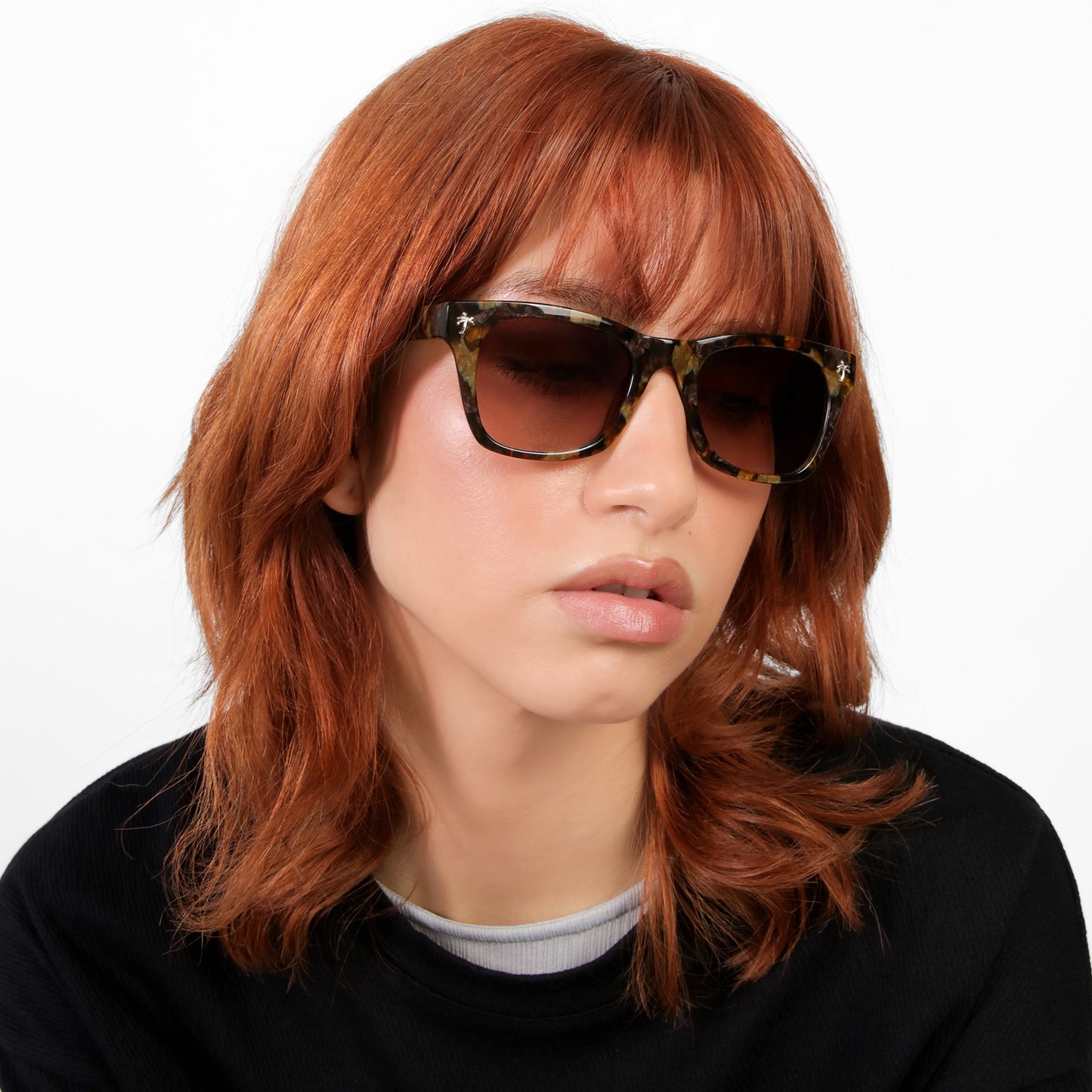 Another angle of model wearing Hibiscus Sunglasses in Brown Marble with Brown Gradient lenses 