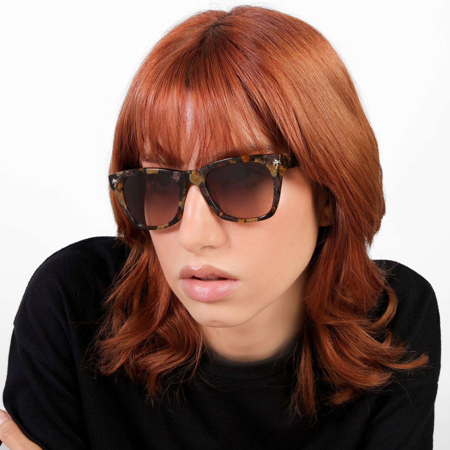 Model wearing Hibiscus Sunglasses in Brown Marble with Brown Gradient lenses