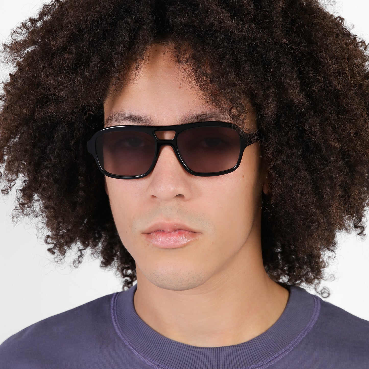 Another angle of man wearing Morningside Sunglasses in Black with Grey Gradient