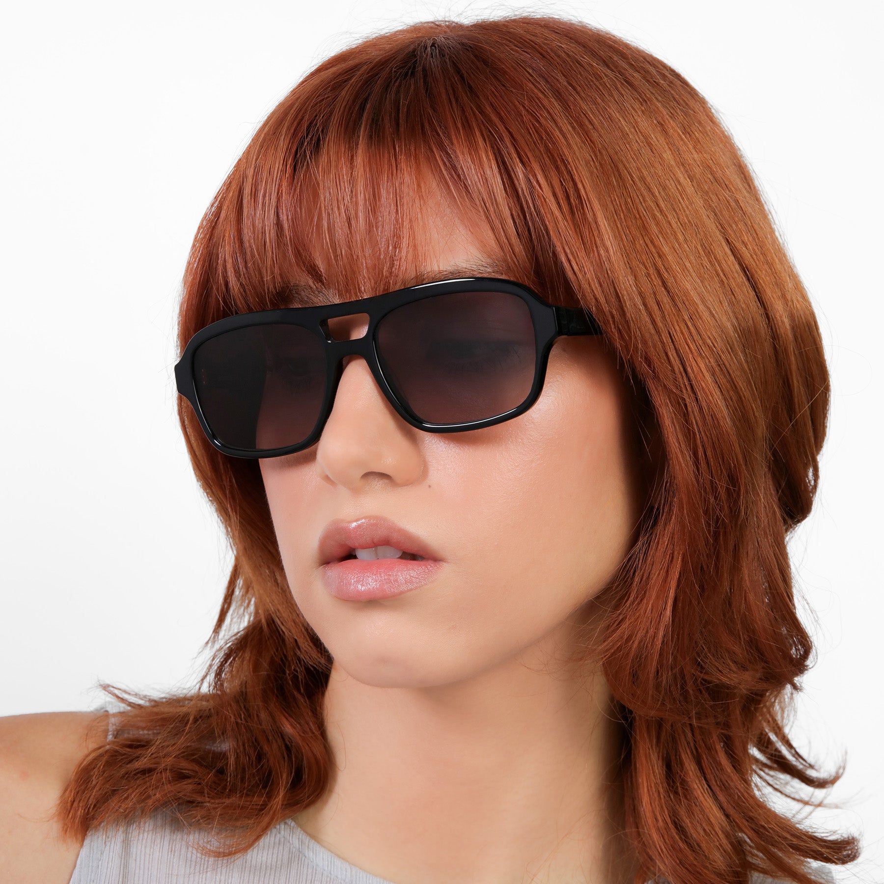 Another angle of model wearing Morningside Sunglasses in Black with Grey Gradient