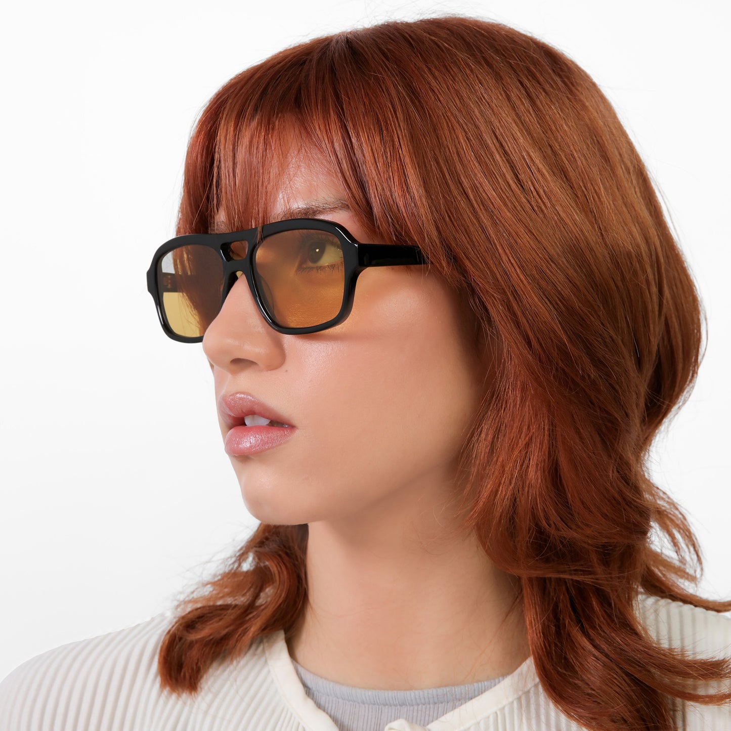 Model wearing Morningside Sunglasses in Black with Yellow See Through