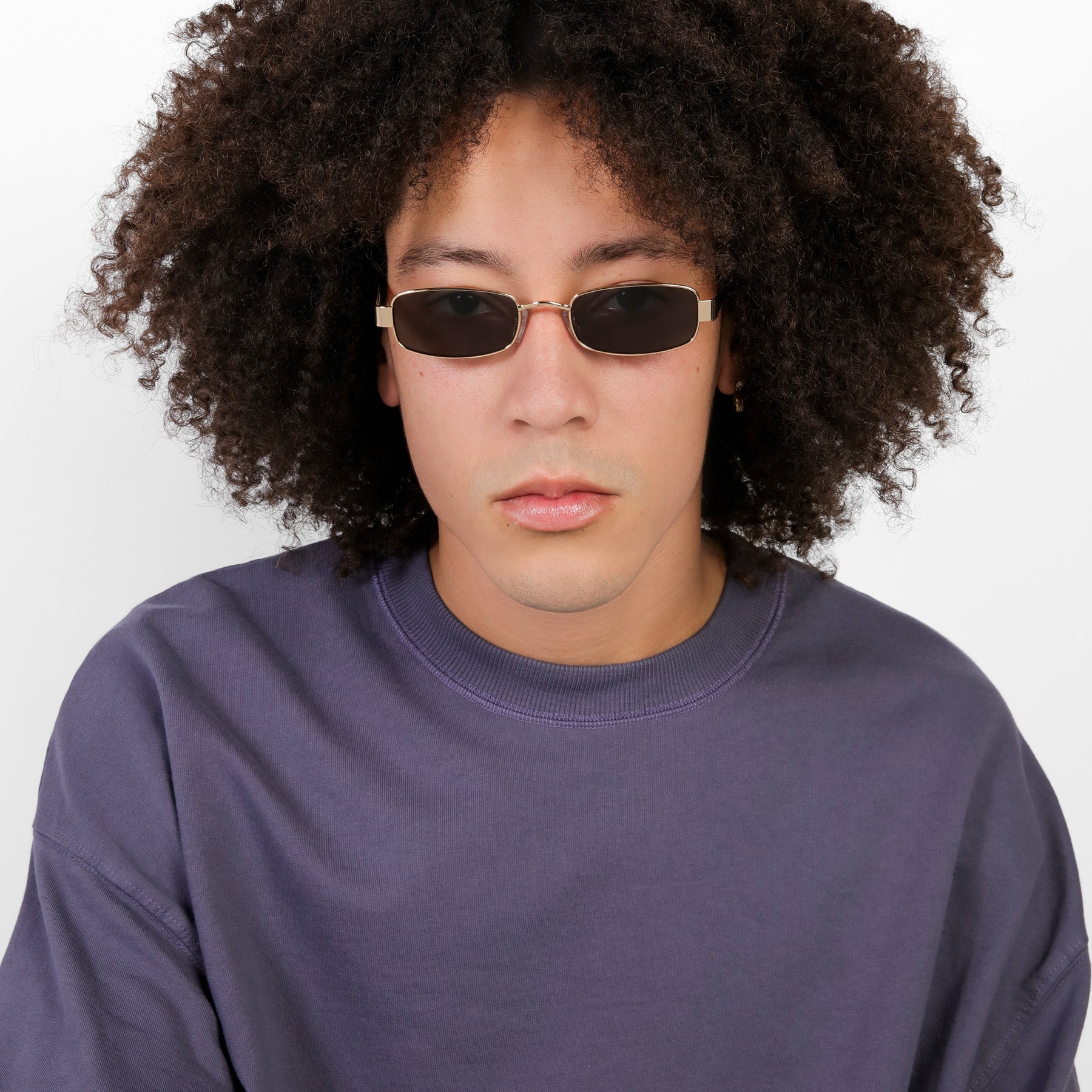 Man wearing Shores Sunglasses in Gold with Grey lenses