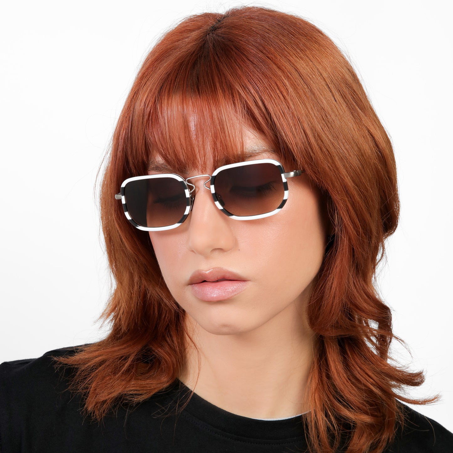 Model wearing Venetian Sunglasses in Black White Stripes with Brown Gradient lenses